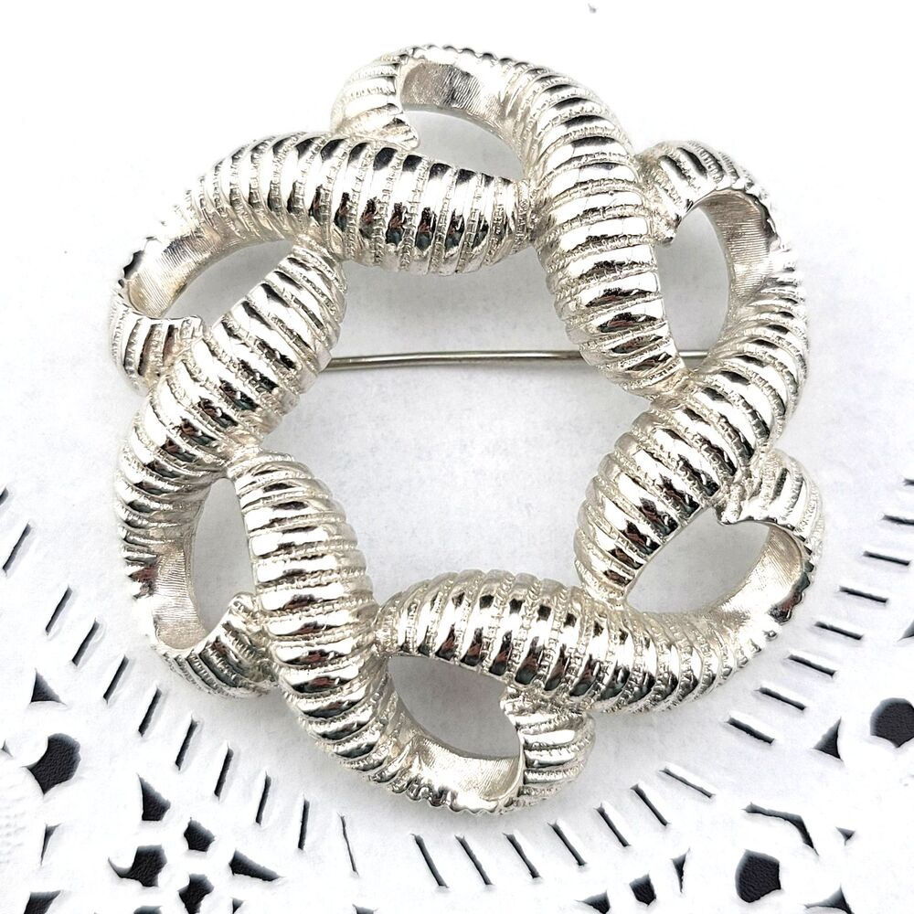 Vintage Signed Monet Rhodium Finish Infinity Knot Ribbon Statement Brooch Pin